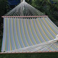 Colorful striped fabric hammock for outdoor use.